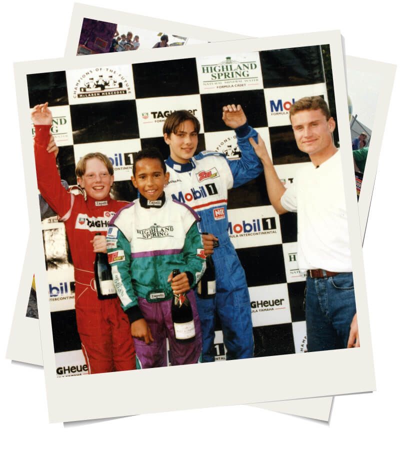 Lewis Hamilton celebrates a karting victory with other boys and David Coulthard
