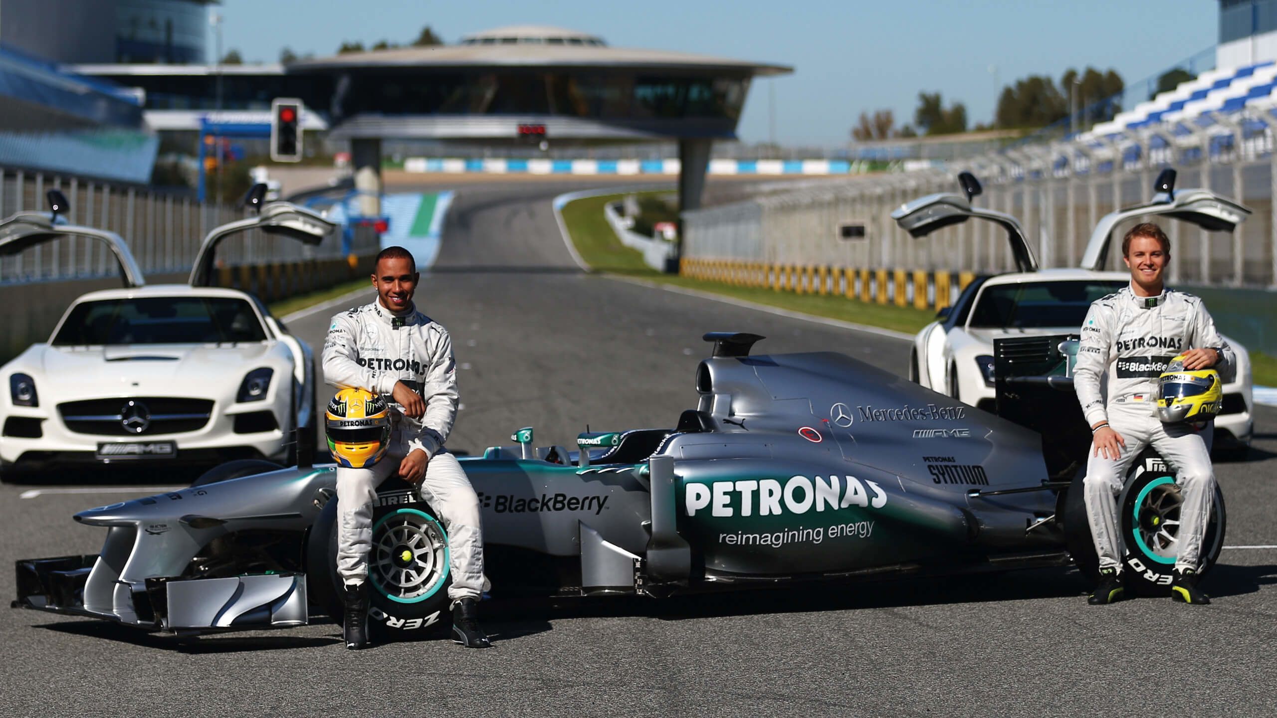 Lewis Hamilton and Nico Rosberg unveil the Mercedes car in 2013