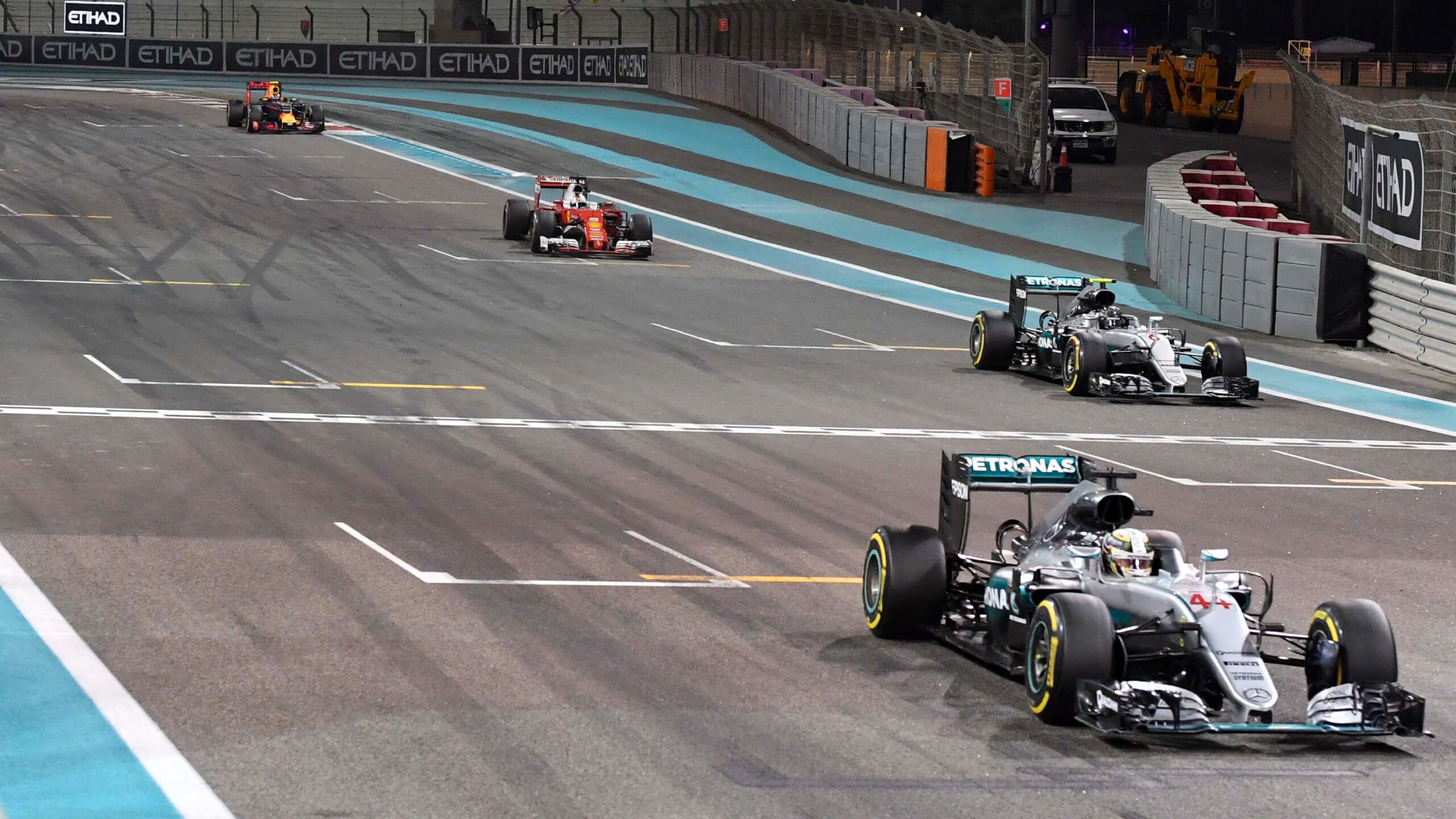 Lewis Hamilton and Nico Rosberg cross the finish line in Abu Dhabi in 2016