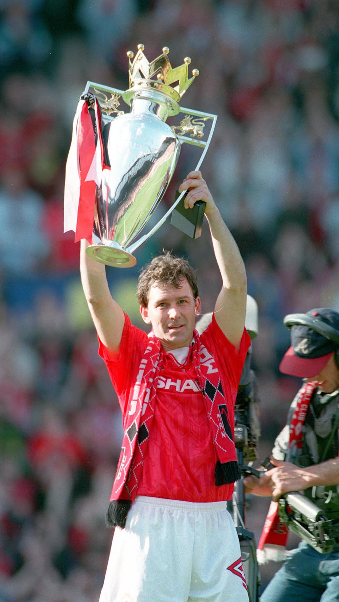 Bryan Robson with the Premier League trophy in 1993