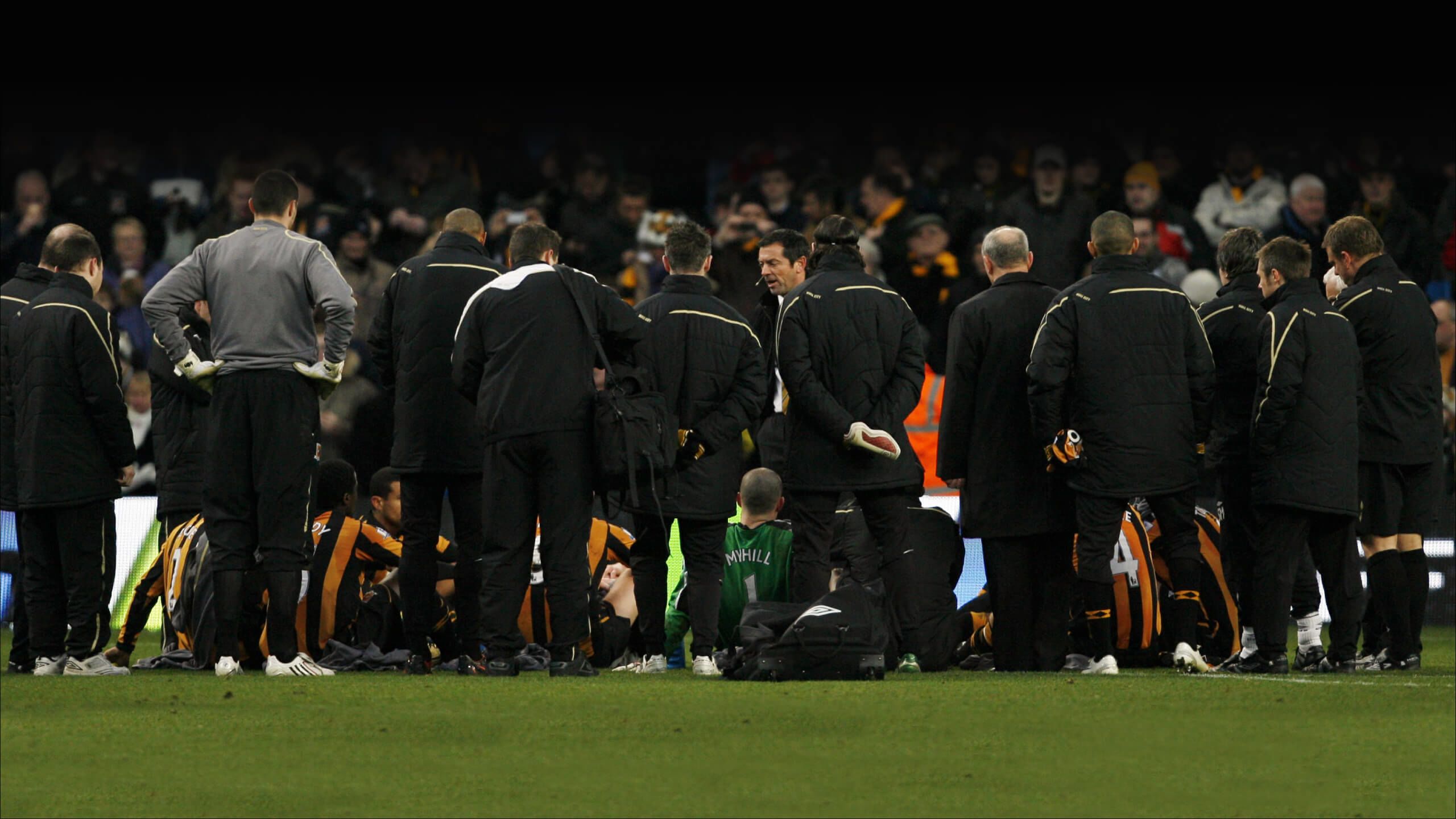 Phil Brown gives his a team talk at half-time to his Hull players at the Etihad in 2008