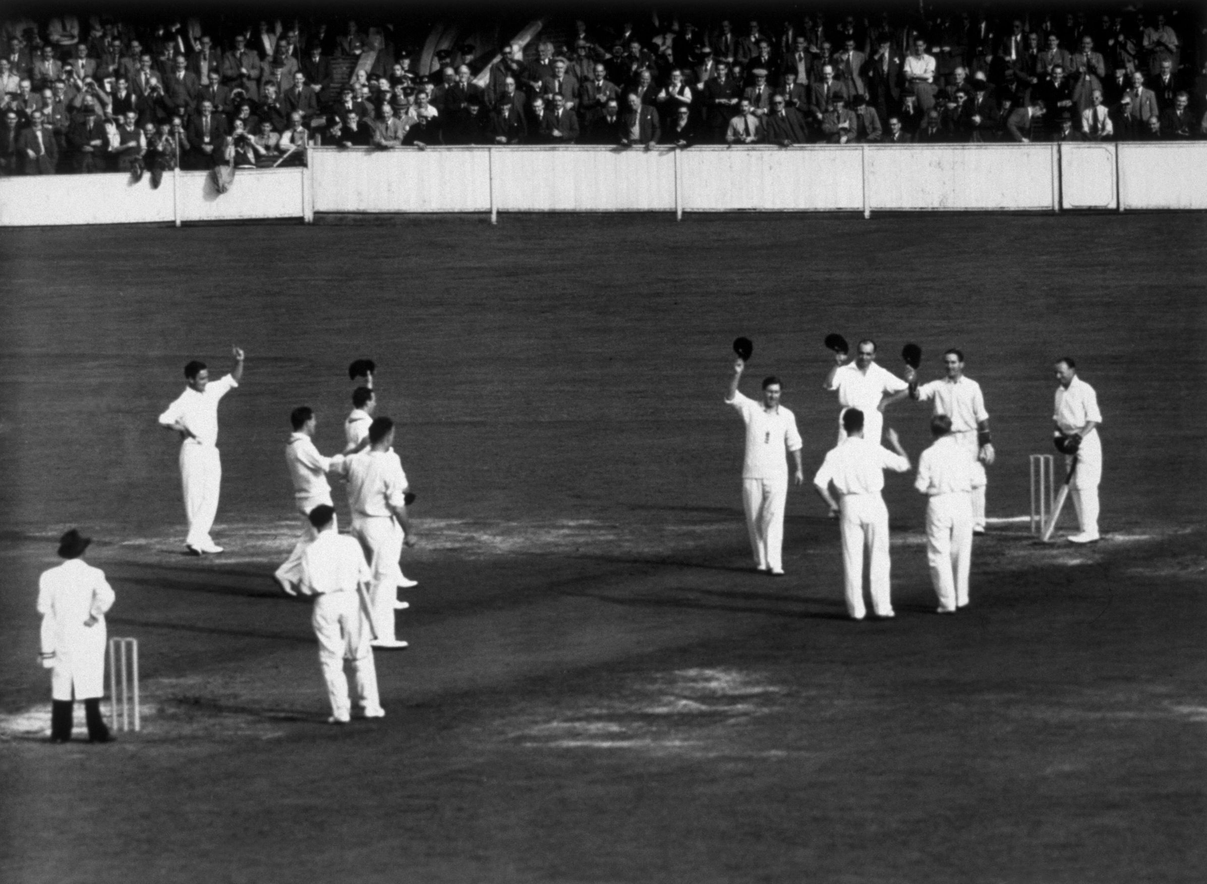 England fielders give Don Bradman three cheers as he arrives at the crease for his final innings 
