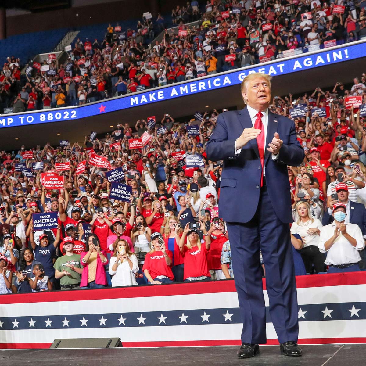 Trump with crowds behind him