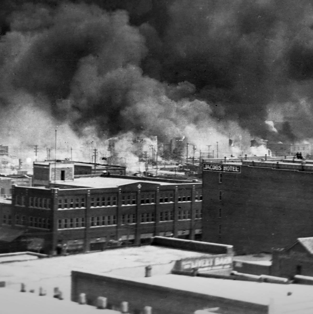 Smoke billows from fires during the Tulsa race massacre of June 1921