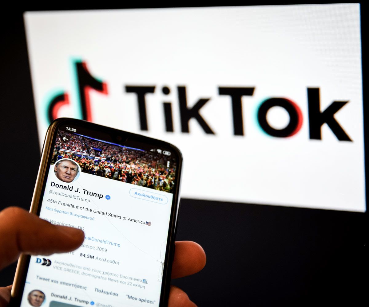 Donald Trump's twitter account on a phone - with the Tik Tok logo behind
