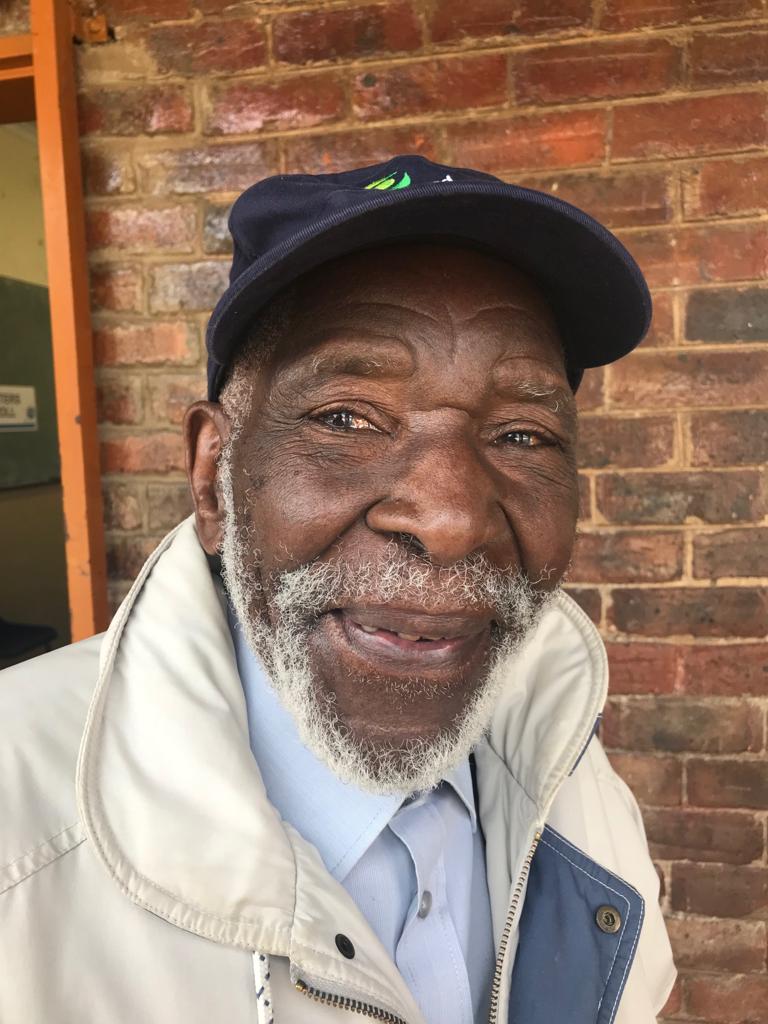 Older man waiting to vote