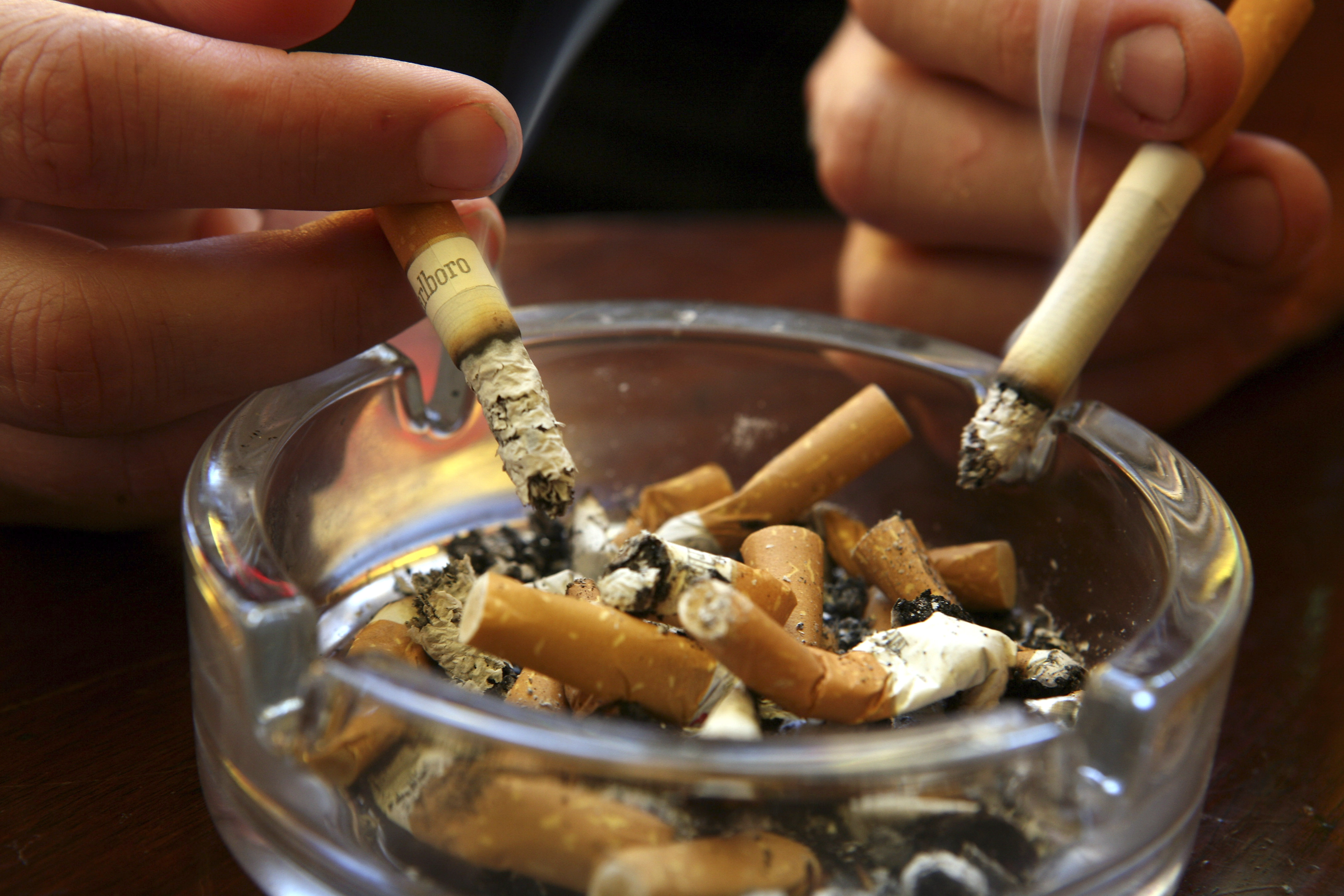 A couple smoke cigarettes in a public house in Bath, on June 30 2007 in Somerset, England.