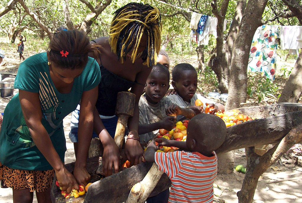 Children sorting out tomatoes