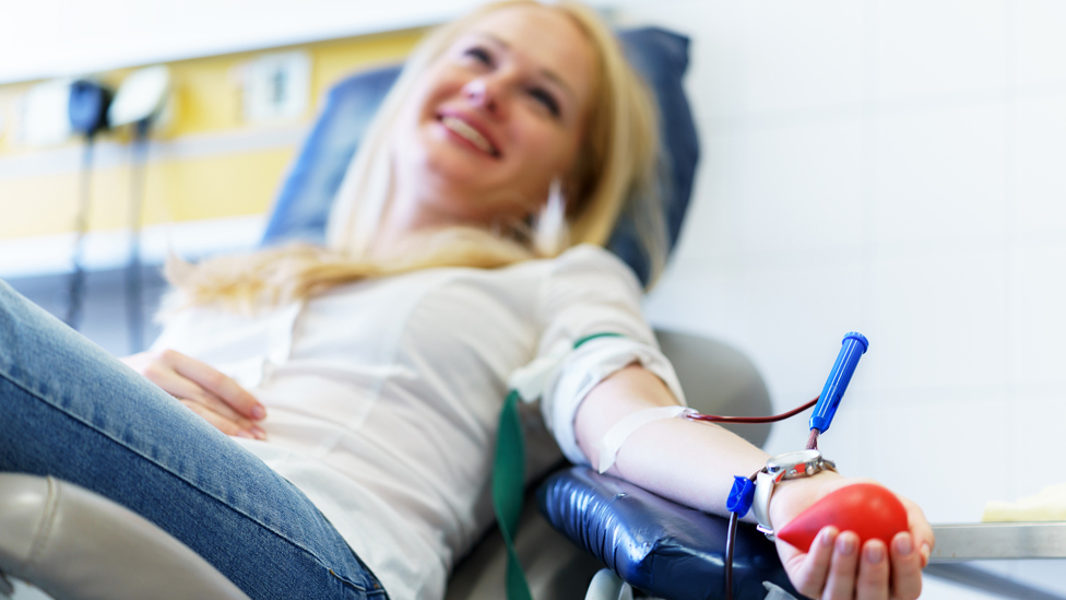 Woman giving blood