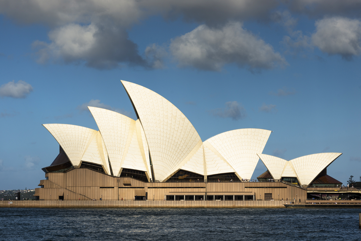 Joe Bertony with a model of the Sydney Opera House arch