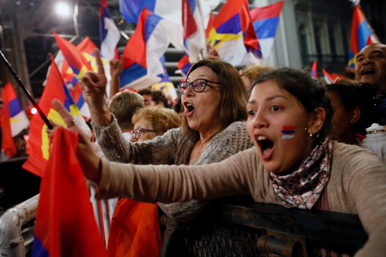 Supporters of presidential candidate Daniel Martinez celebrate in Montevideo