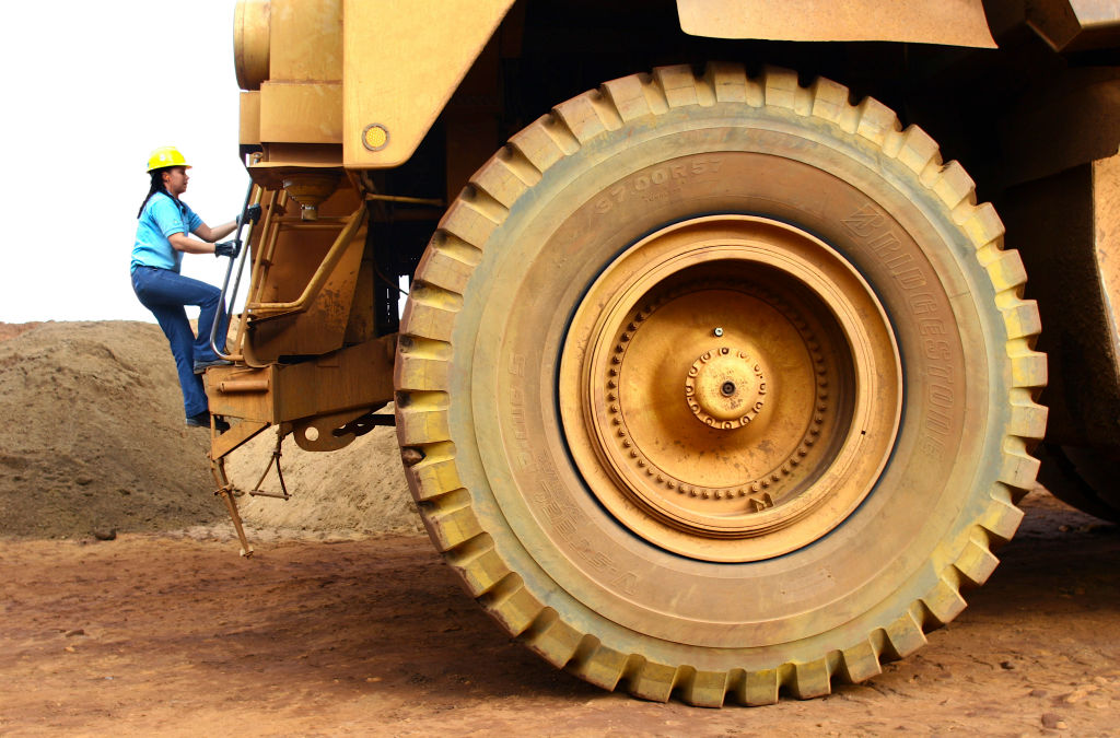 Women climbing on a tractor