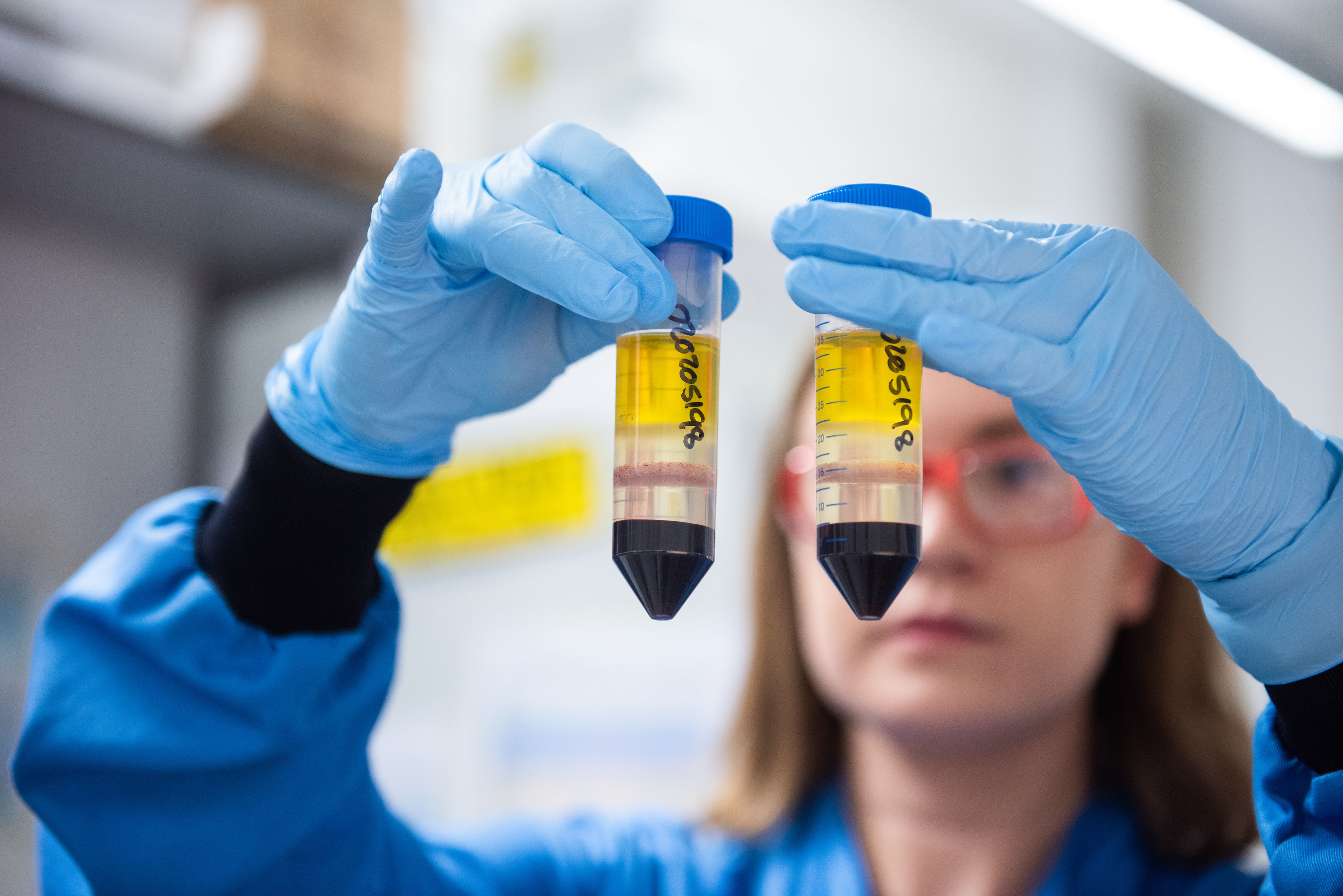 Scientist holding vials