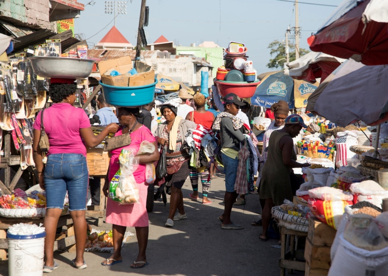 People walk in a market as they go about their lives in Port-au-Prince, Haiti, May 24, 2021