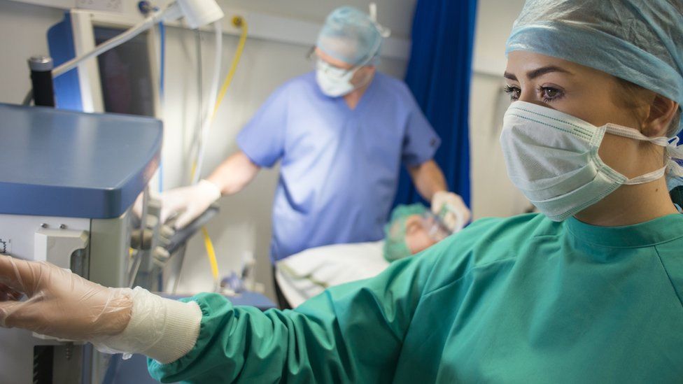 Hospital workers wearing PPE