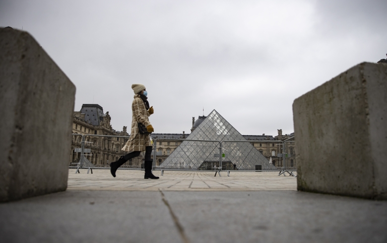 Woman in front of the Louvre