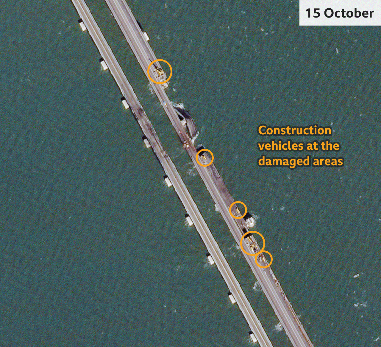 Satellite imagery taken one week after the blast show construction vehicles near the damaged sections of the bridge.