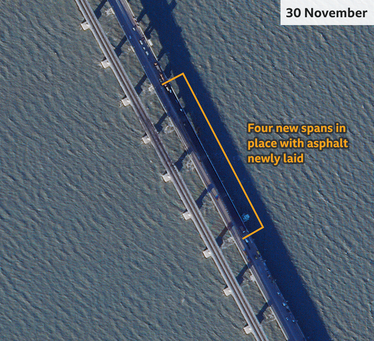 One month later, the bridge appears to have been fully repaired, with four new segments installed and fresh asphalt applied