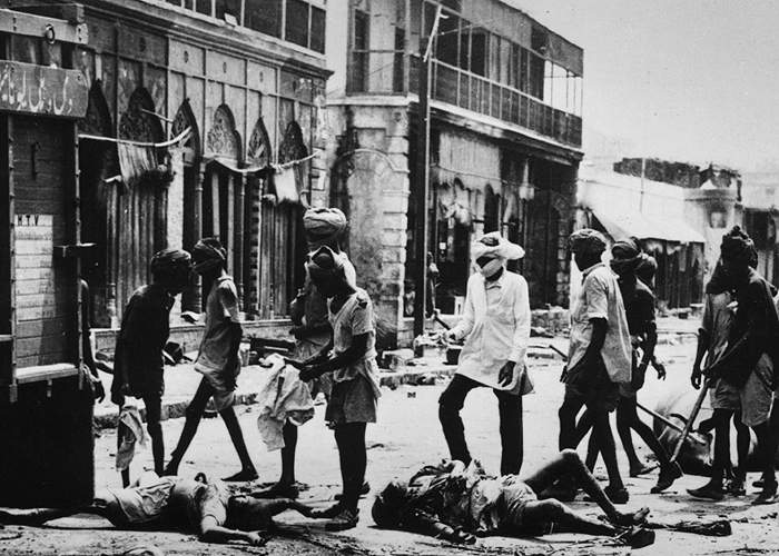 &amp;nbsp;Bodies removed from a street after rioting in Delhi(Getty Images)