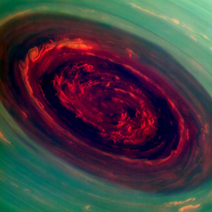 False-colour image of a giant spinning storm at Saturn&#39;s north pole - it resembles&amp;nbsp;a deep red rose(Nasa)