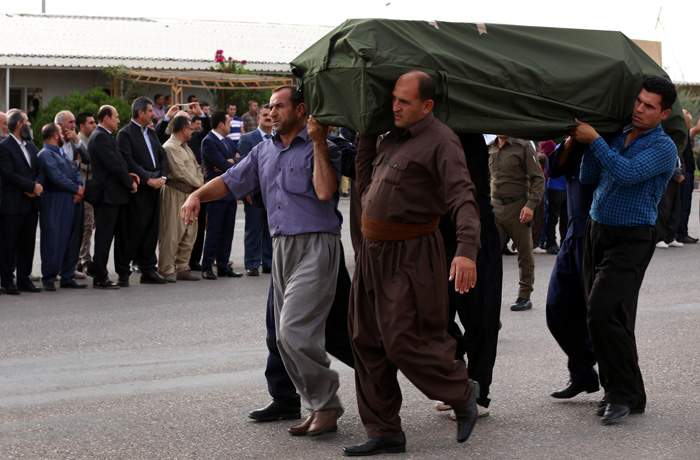 October 2015: Iraqi Kurdish men carry the body of one of 71 asylum seekers suffocated in an Austrian lorry