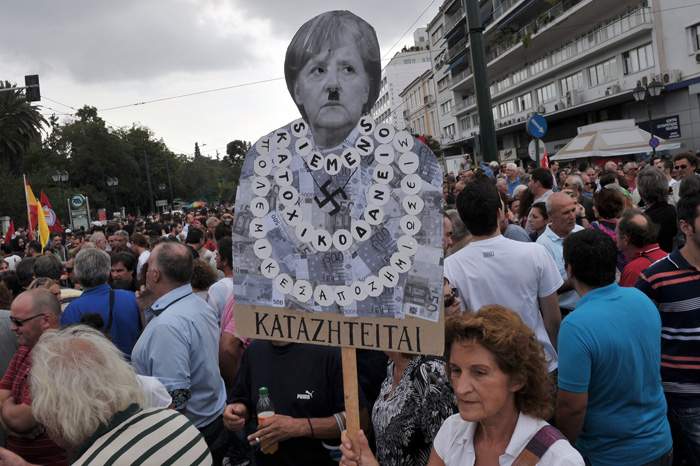 A 2012 protest in Athens against EU austerity measures depicts Merkel as Hitler