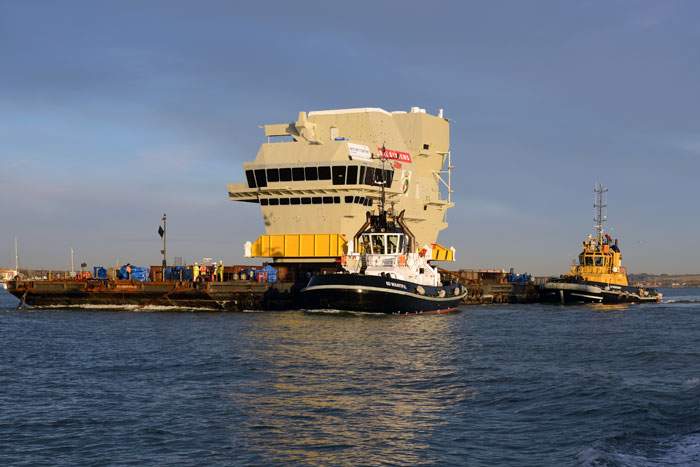 2013: The forward island of the Queen Elizabeth is transported out of Portsmouth Harbour