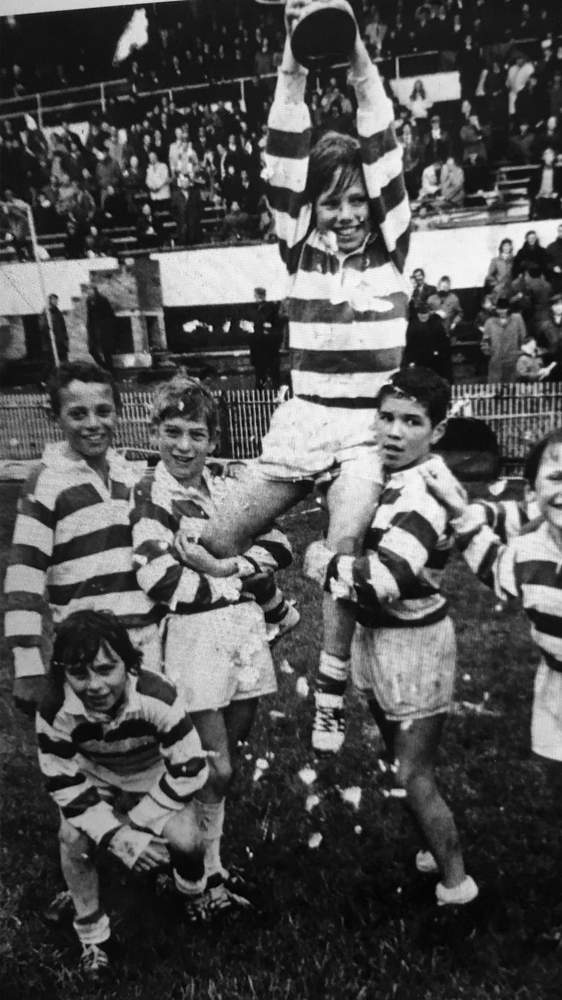 Schoolboys Cup victory at Cardiff Arms Park: Winning try scorer John Actie holds the captain aloft, with David Bishop crouching down (bottom left)