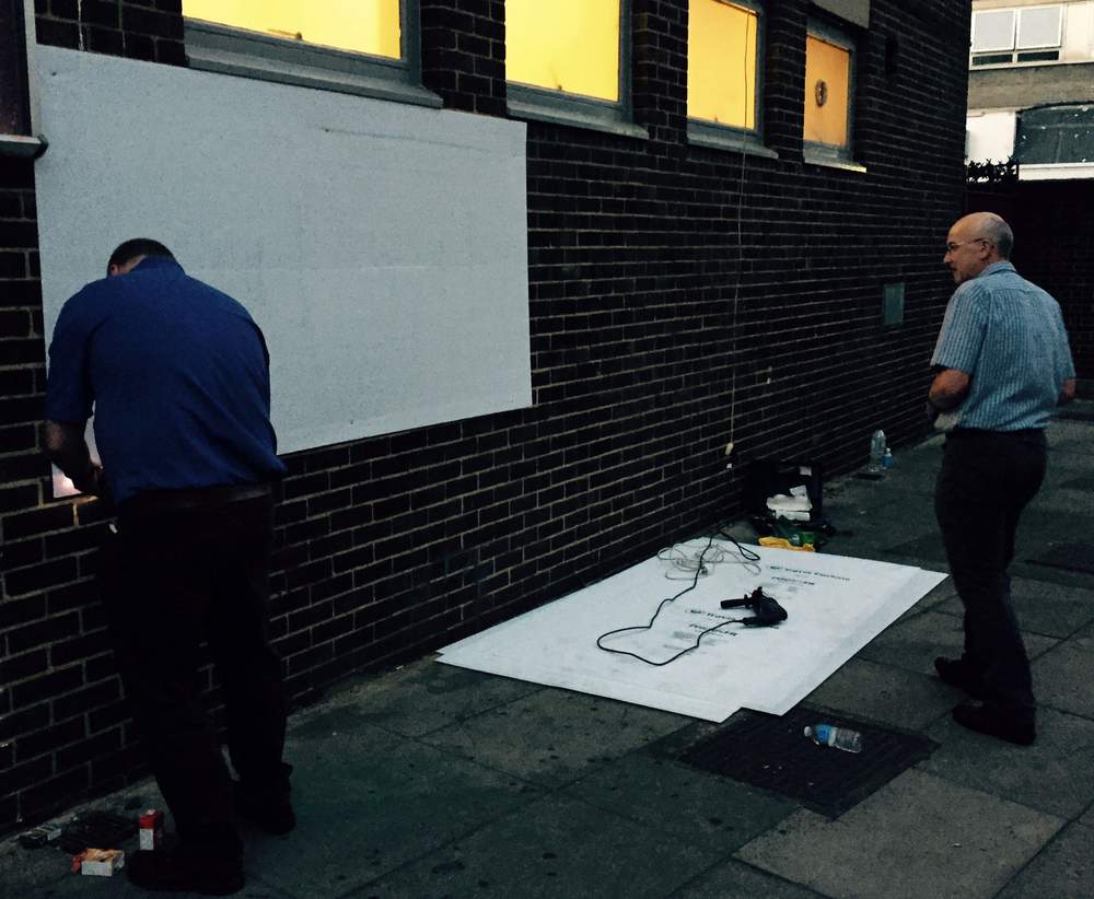 Volunteers construct the wall