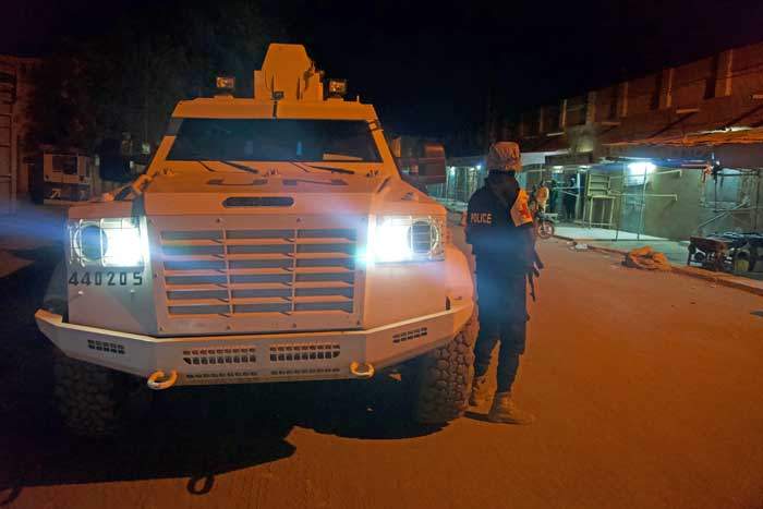 UN peacekeepers escort police by night