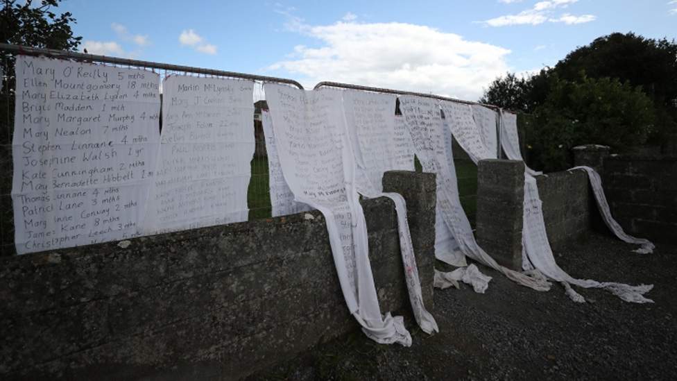 Bedsheets with the names of victims have been put on the shrine&#39;s gates