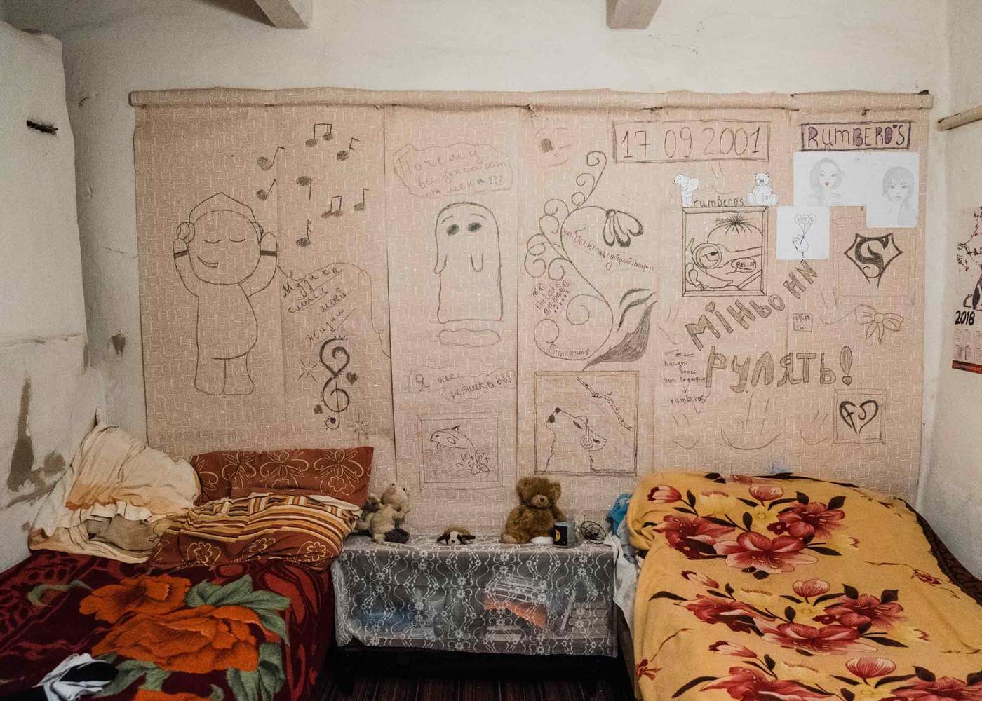 Iryna's sketches cover the walls of the sisters' bedroom