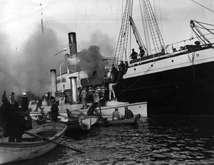 1915: A ship on fire in Salonica harbour