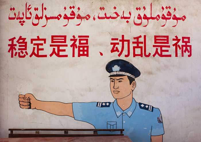 A wall poster in Xinjiang reads: “Stability is a blessing, instability is a calamity”