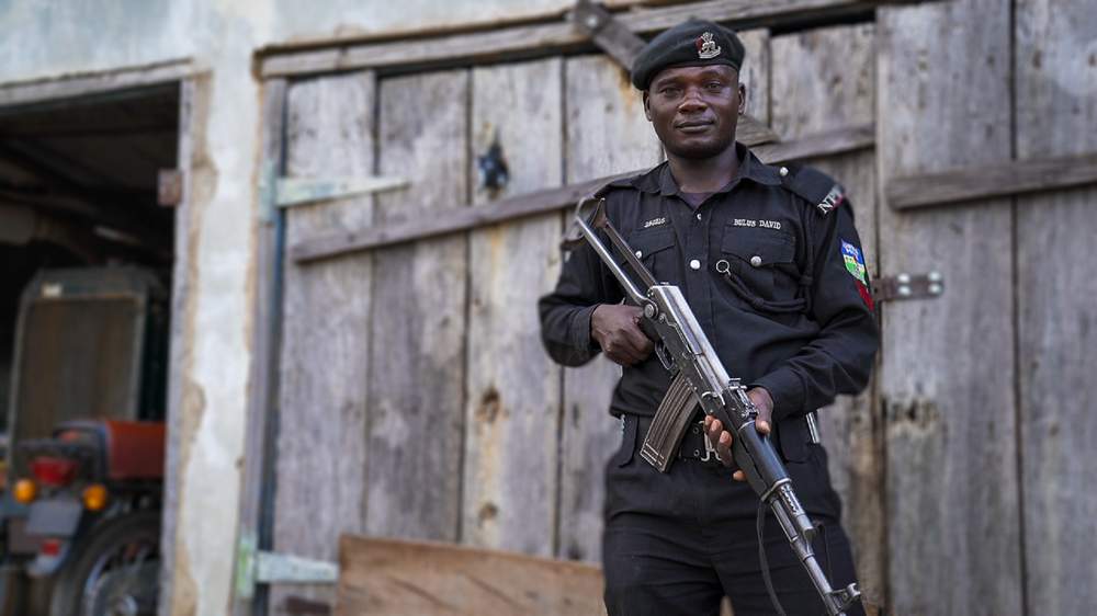 Policeman guarding the police headquarters in Jos