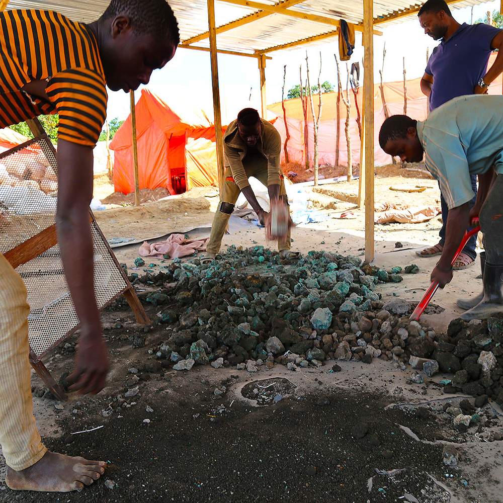 Artisanal miners sorting minerals