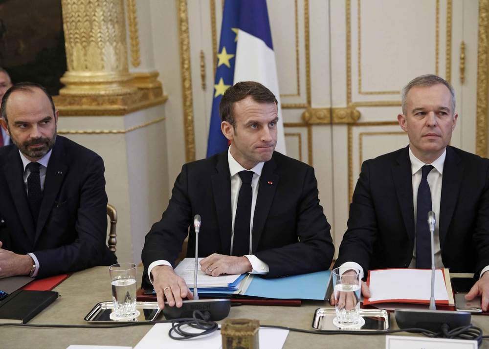 (From L) French Prime Minister Edouard Philippe, French President Emmanuel Macron and French Ecology Minister Francois de Rugy meet with representatives of trade unions