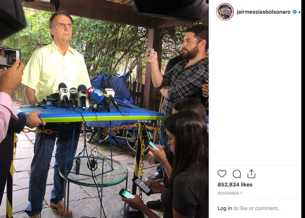 Microphones placed on top of a bodyboard at a press conference held at Bolsonaro&#39;s home