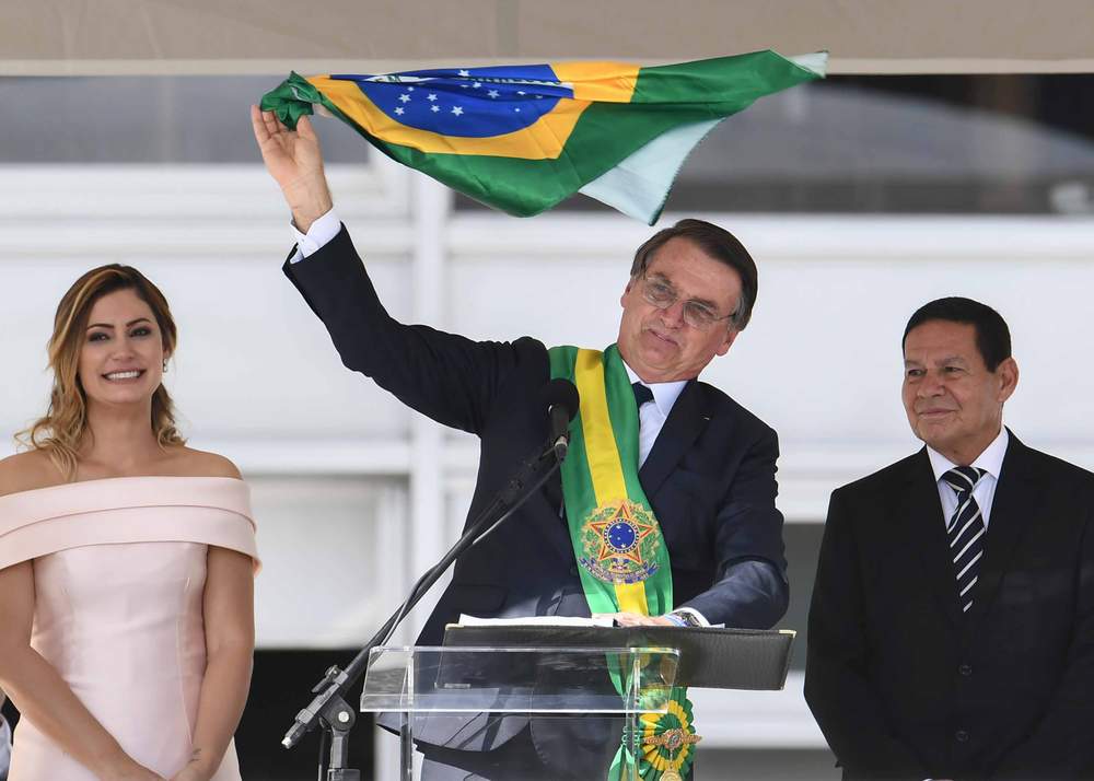 First Lady Michelle Bolsonaro (L), Jair Bolsonaro (C) and Vice-President Hamilton Mourão (R) during their inauguration ceremony&amp;nbsp;