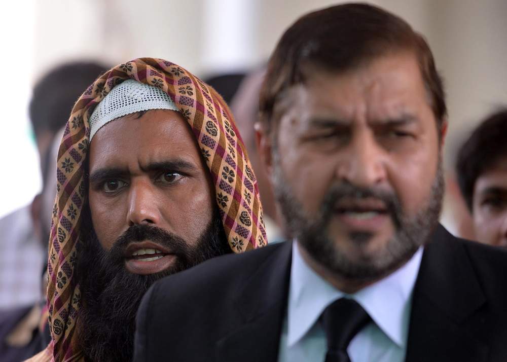 Qari Salim (L) and his lawyer Ghulam Mustafa Chaudhry (R) speak to the media outside the Supreme Court in Islamabad