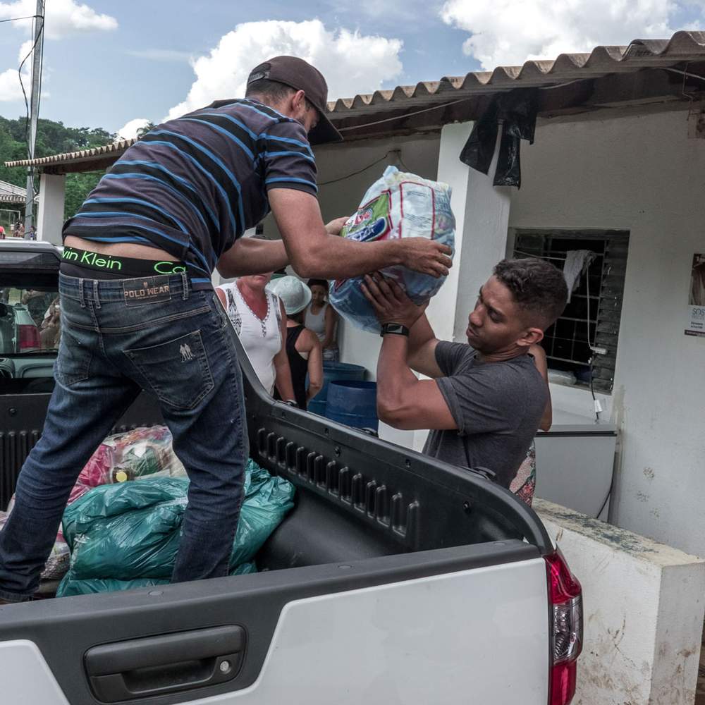 Food parcels are distributed to the hundreds of families left homeless