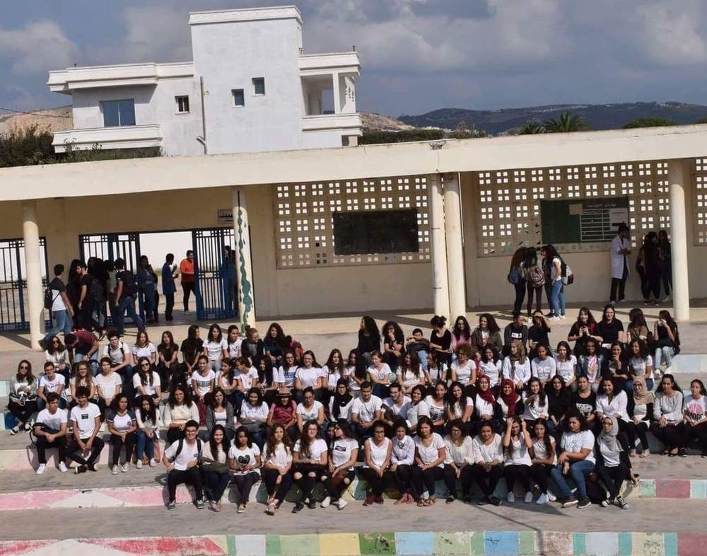 The group took a photo of their white-shirt rebellion on the day The group took a photo of their white-shirt rebellion on the day