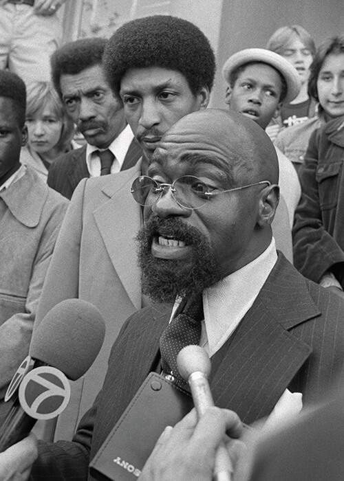 Carter (front) and Artis (behind him) outside the courthouse