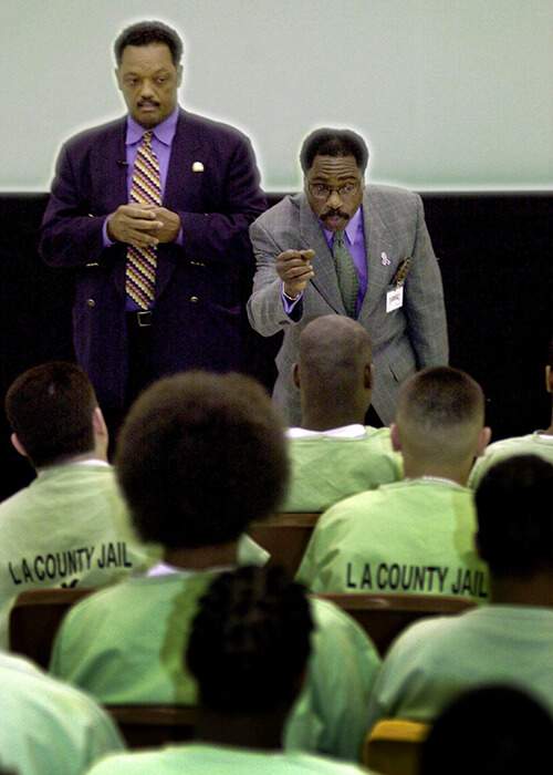 Carter and Reverend Jesse Jackson speak to inmates inside the Pitchess Detention Center in Los Angeles County, California