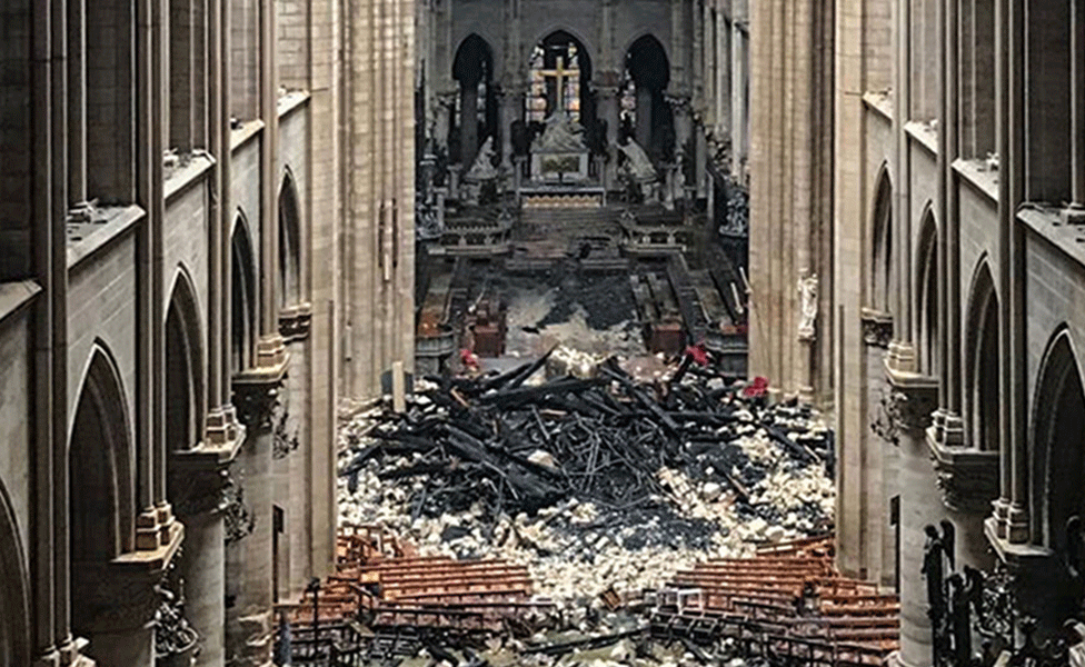 Debris of the fallen spire inside Notre Dame