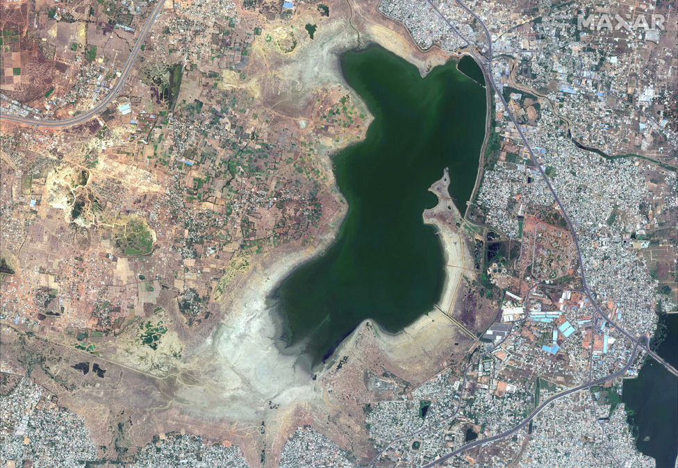 The Puzhal reservoir appears to be half empty in this satellite photograph, with large areas of brown dust or mud visible in this April 2019 image