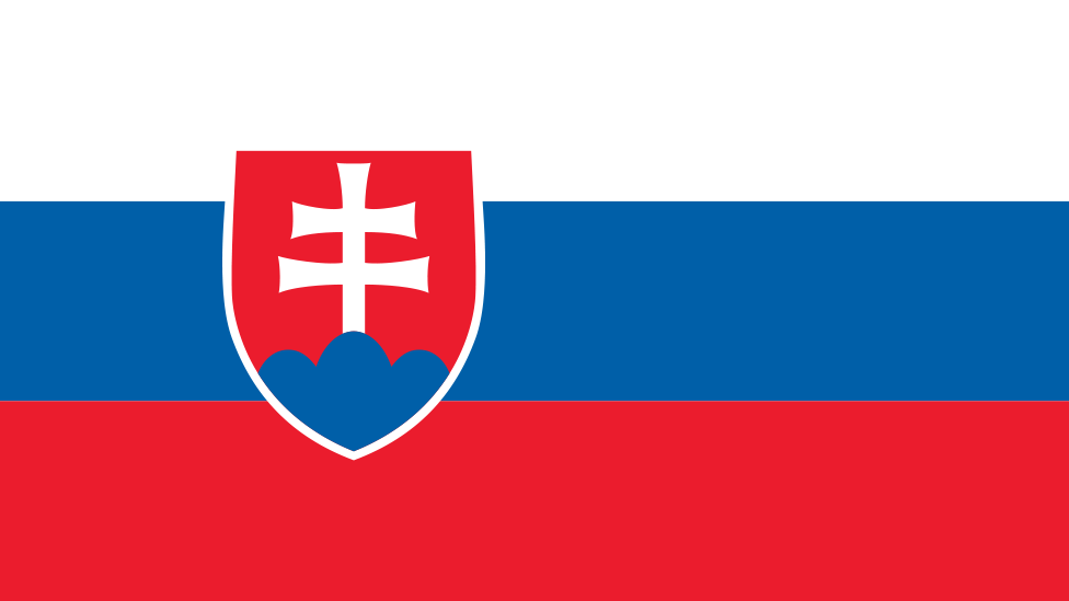 Slovakia's flag - top to bottom white, blue, and red, with a crest positioned left showing a double-armed white cross on a red background. 